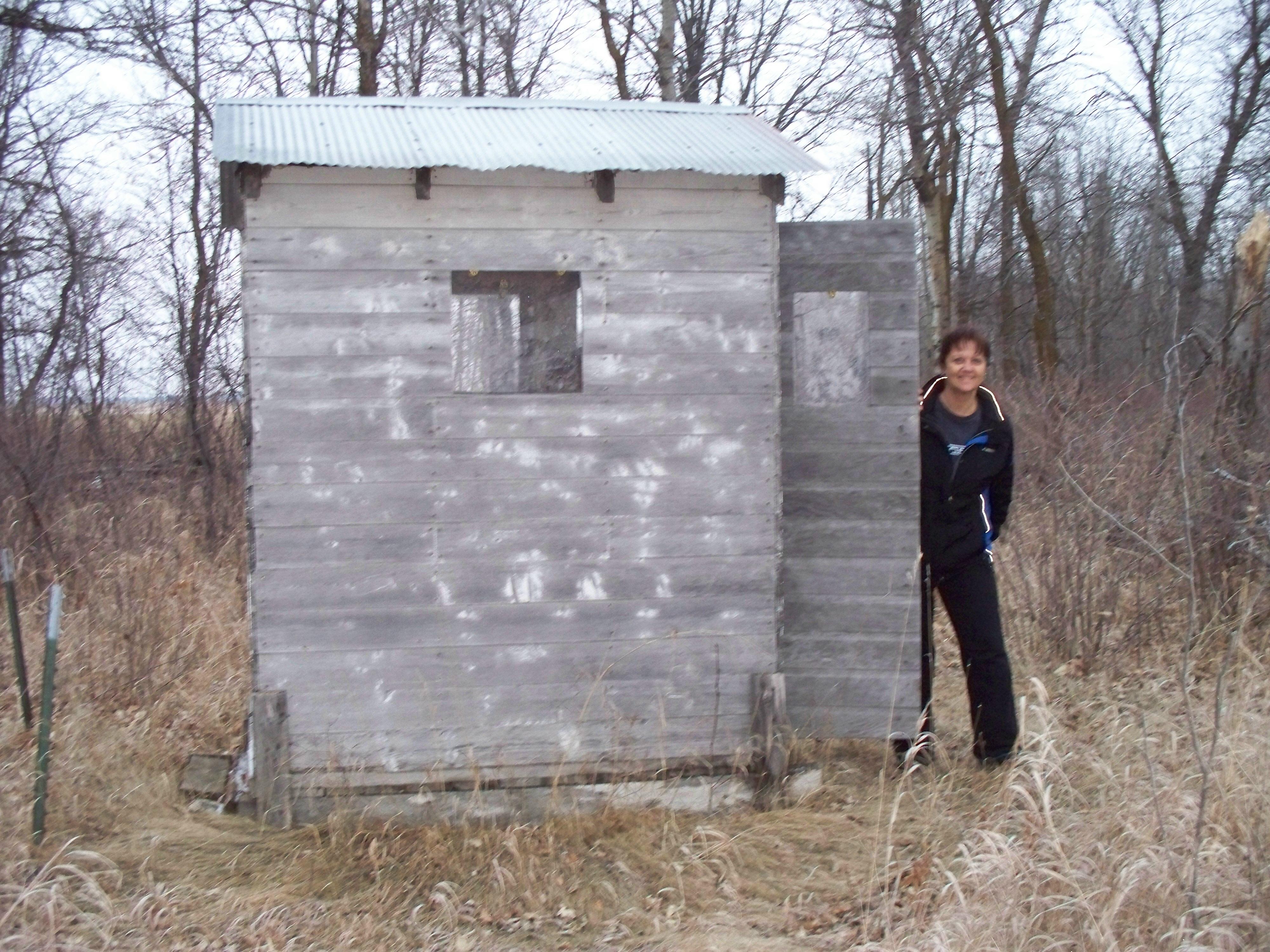 girl and outhouse